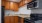 a kitchen with wooden cabinets